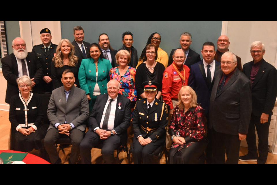 Newmarket-Aurora MP Tony Van Bynen with the 20 local recipients of the King Charles III Coronation Medal Dec. 13 at the high tea reception at the Old Town Hall in Newmarket.