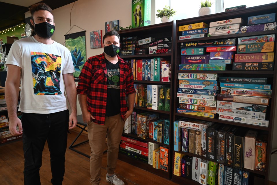 Brothers Felix and Eddi Rayle held a grand opening for their Newmarket board game cafe Sept. 30, after making it through 18 months of business in the pandemic. 