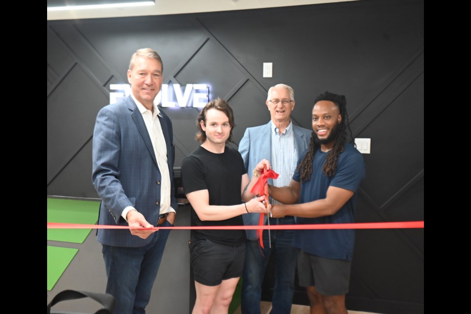 Newmarket Mayor John Taylor cuts the ribbon for the officially opening of Evolve Health and Fitness, alongside owner Sam Taylor, Councillor Victor Woodhouse, and owner Jurdaine Tatham-Crawford. 