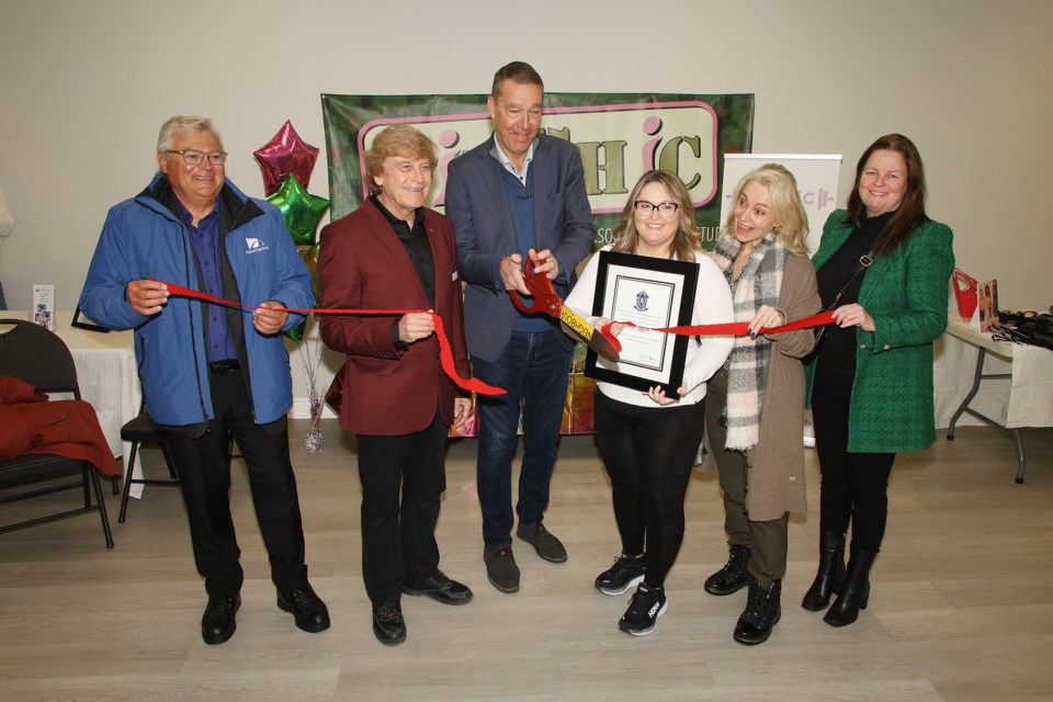 Councillor Bob Kwapis, Deputy Mayor Tom Vegh, Mayor John Taylor, FitChic owner Krista Sommer, and councillors Grace Simon and Kelly Broome cut the ribbon for the grand opening of FitChic Infinity Feb. 23. .