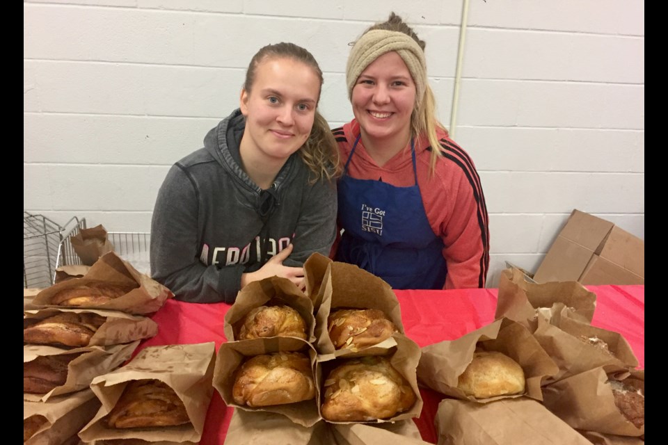 Clarissa Vebsalainen (left) and Laura Niemi of Niemi Family Farm of Mount Albert sell fresh bread. Debora Kelly/NewmarketToday