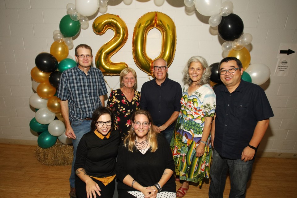 The Newmarket Farmers Market board of directors celebrates the market's 20th anniversary at the harvest dinner Saturday night at the community centre.  Greg King for NewmarketToday