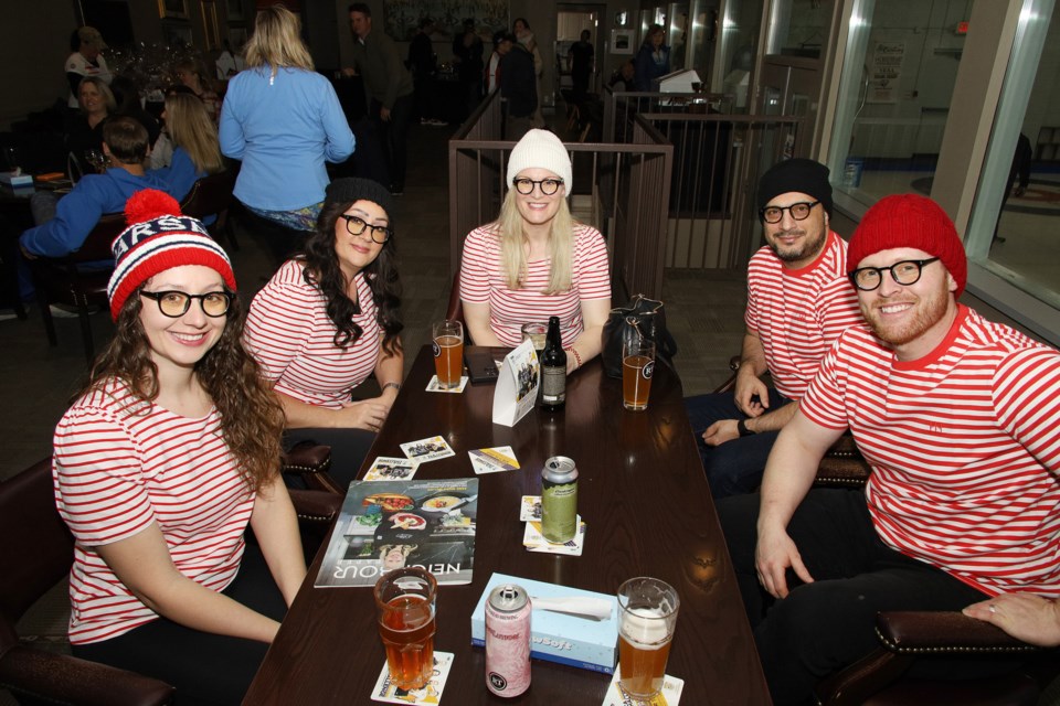 There's Waldo! Katherina Marche, Lindsay Garcia, Allison Crozier, Sam Bawab, and Adam Marche take part in the 4th annual Red Thread Brewing curling bonspiel at York Curling Club in Newmarket in support of the local chapter of the Canadian Mental Health Association.  Greg King for NewmarketToday