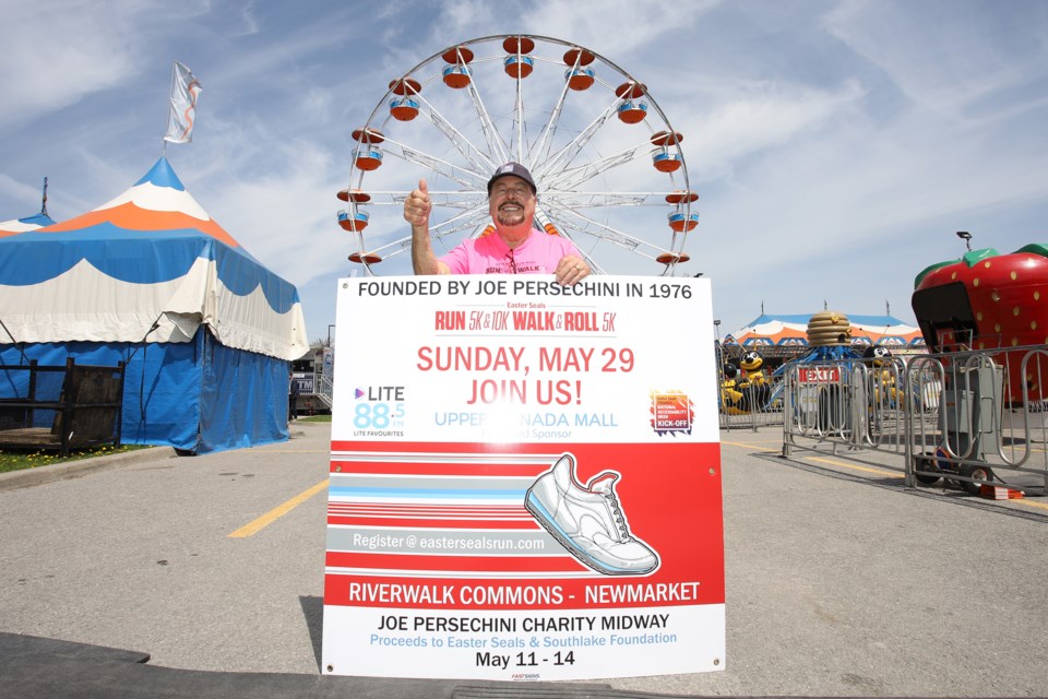 Charity event namesake Joe Persechini, who has been supporting Easter Seals for 43 years, was at the opening of the Perschini Charity Midway that continues to 11 p.m. Saturday and from 11 a.m. to 5 p.m. Sunday at the Magna Centre.  Greg King for NewmarketToday