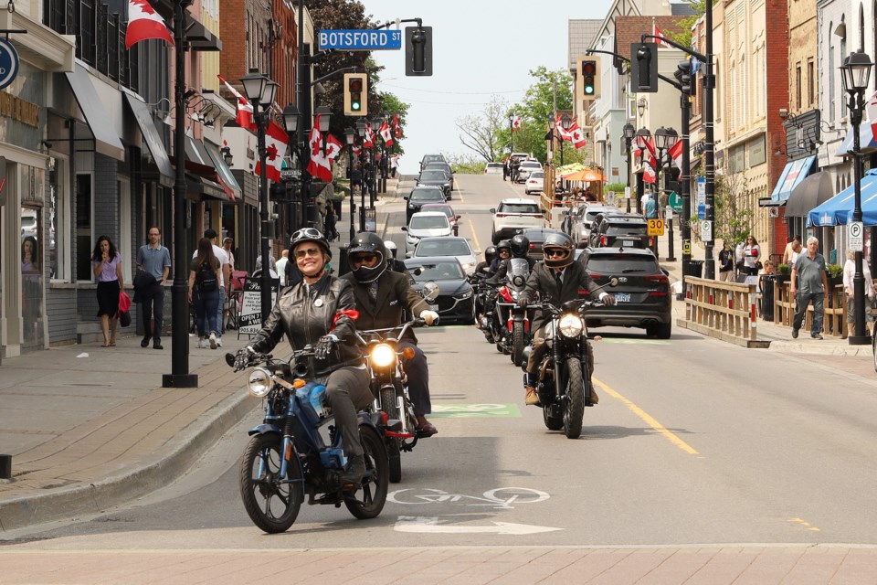 Newmarket resident and realtor Sheila Stewart leads the first Newmarket Distinguished Gentleman's Ride along Main Street Sunday. She organized the first local ride, which is an international event in support of prostate cancer care and men's mental health, after participating for several years in Toronto. Greg King for NewmarketToday