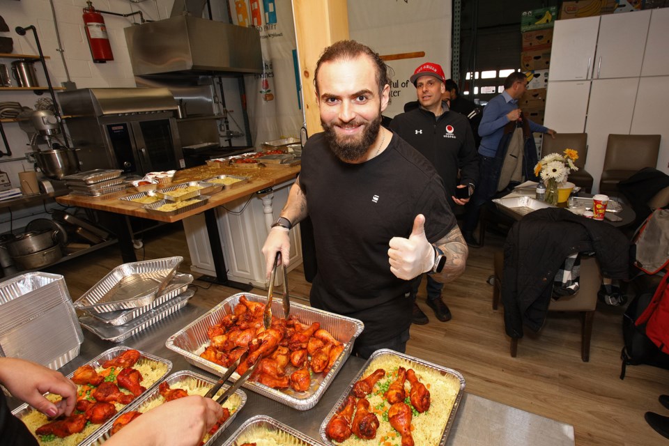 Samer El Ahmar puts together family dinners as part of a Concierge Realty Group initiative to cook a total of 1,000 meals for the Newmarket Food Pantry during the month of Ramadan. 