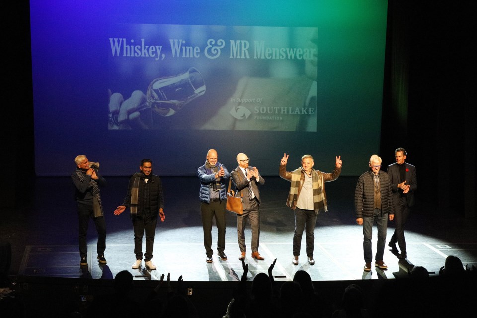 Returning after a pandemic pause, the Nov. 10 Whiskey, Wine and MR Menswear event featured Southlake physicians and volunteers taking to the catwalk to benefit the Stronach Regional Cancer Centre at Southlake Regional Health Centre. Here, event founder Mike Rathke, owner of MR Menswear (far right), salutes his models.  Greg King for NewmarketToday