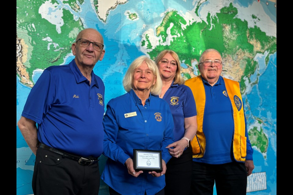 Newmarket Lions Club members Rick Metcalfe (from left), Sylvia Brock, Megan Bennett and Kirby Brock were at Pickering College to accept an agent of change award.