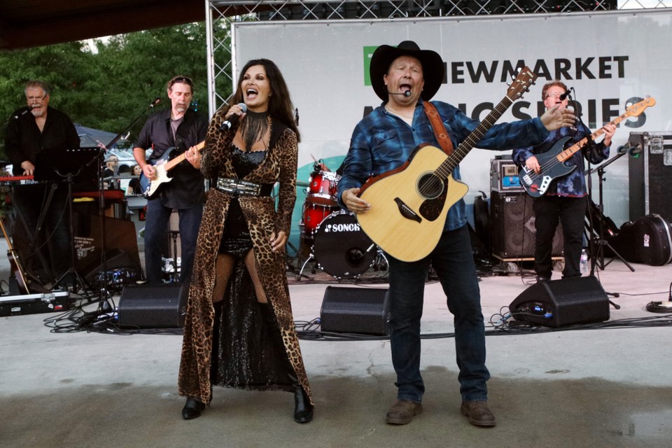 Shania and Garth from Blame It All On Their Roots at the kickoff to Newmarket's TD Music Series of free tribute concerts at Riverwalk Commons July 6.  Greg King for NewmarketToday