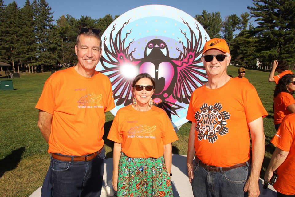 Newmarket Mayor John Taylor, York Region Indigenous relations lead Lauri Hoeg, and Newmarket Councillor Victor Woodhouse at the York Region reconciliation walk on the Nokiidaa trail by the Gijigijigaaneshinh trail marker Sept. 26. 