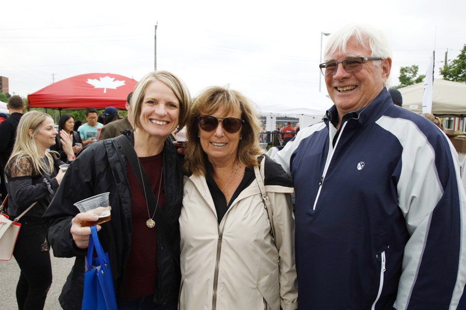 Joanne Merkley, and Nicki and John McLachlan enjoy the variety of the offerings at the Newmarket Craft Beer Festival Saturday.  Joanne prefers Red Line, while John favours Arch.  Greg King for NewmarketToday