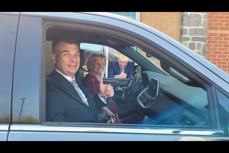 Wes Playter (from left) and Jackie Playter pick up their order from Mayor John Taylor at the drive-thru window at the McDonald's on Yonge Street at Eagle Street. McDonald's Restaurants of P.G. Miller Enterprises Ltd. raised more than $54,000 for Ronald McDonald House – Toronto, Southlake Regional Health Centre and Mackenzie Health. 