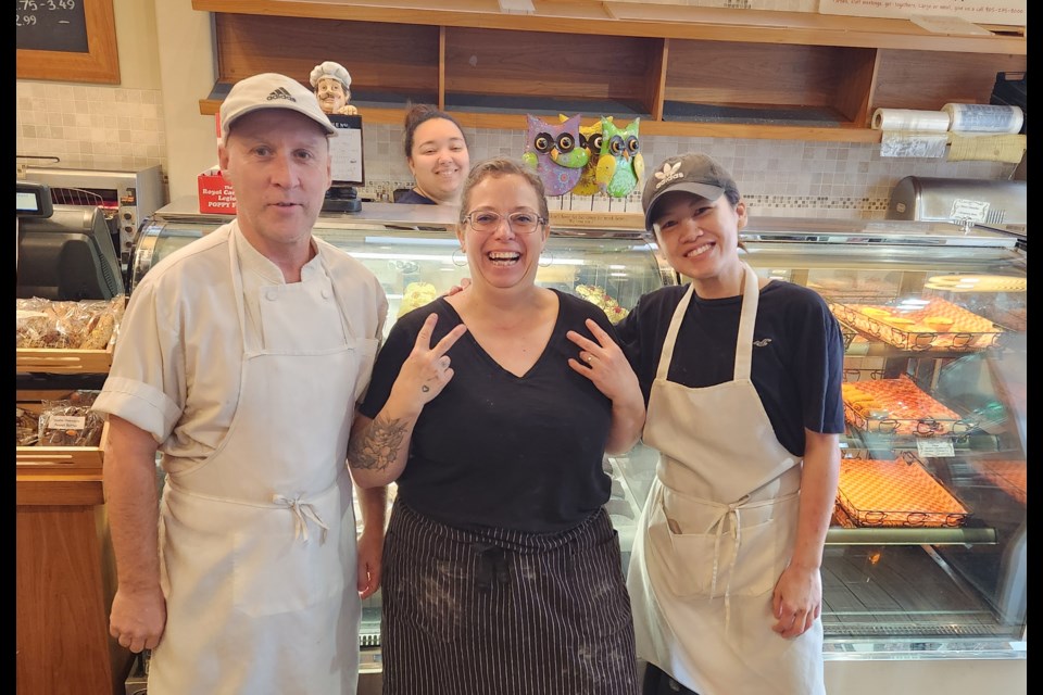 Sarit Bloshtein (centre) stands with Steven and Mei-ki in Bagel World in Newmarket. Bloshtein opened the Newmarket franchise location in 2013 and says her success is thanks to her colleagues, who she says are like family.