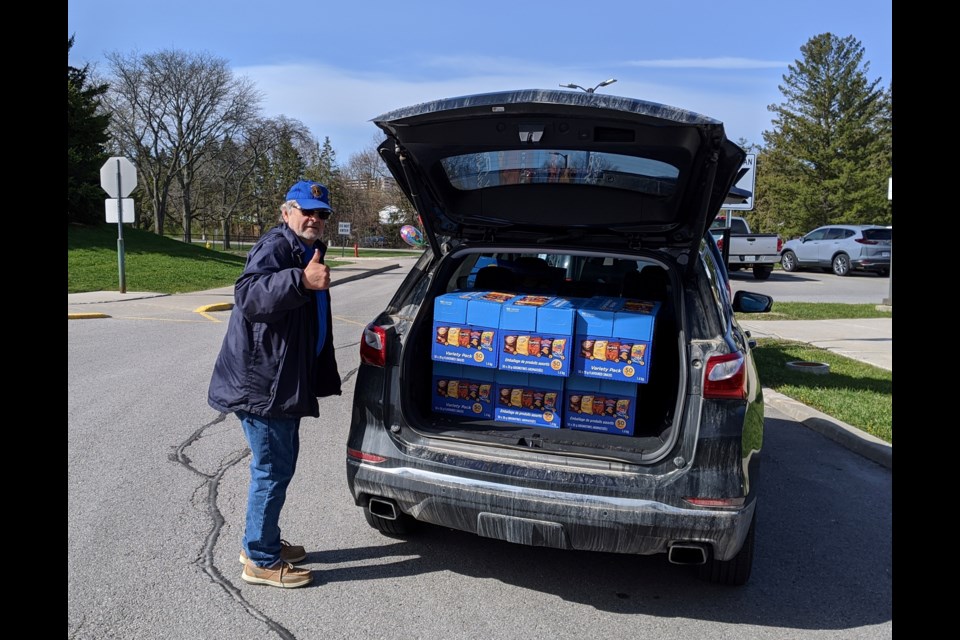 Newmarket Lions Club member John gives a thumbs up for a full delivery heading for the Newmarket Health Centre. Supplied photo/Newmarket Lions