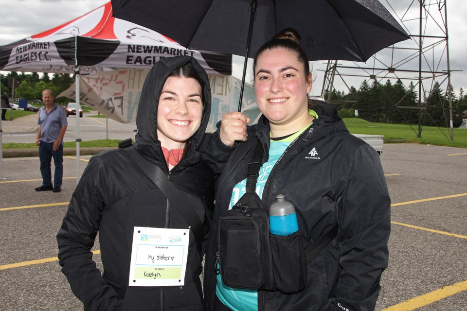 Katelyn Spearing and Kassandra Frias didn't let Sunday's rain dampen their spirits at the Mental Health in Motion annual fundraising event in Newmarket supporting Canadian Mental Health Association York Region South Simcoe.