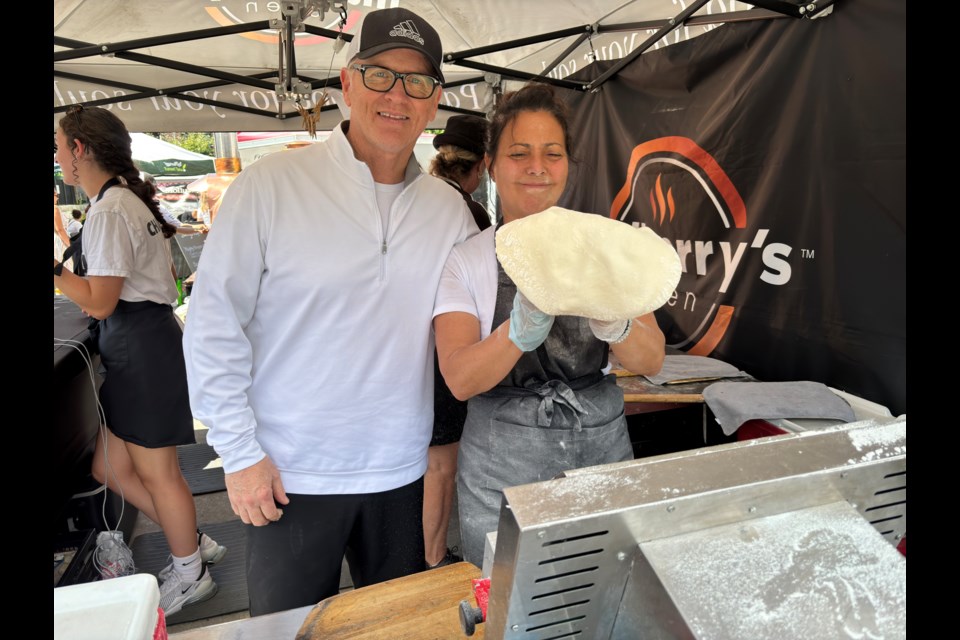 Tim McClure and Ketty Berton welcome customers to Mulberry's Oven at the Newmarket Farmers' Market.