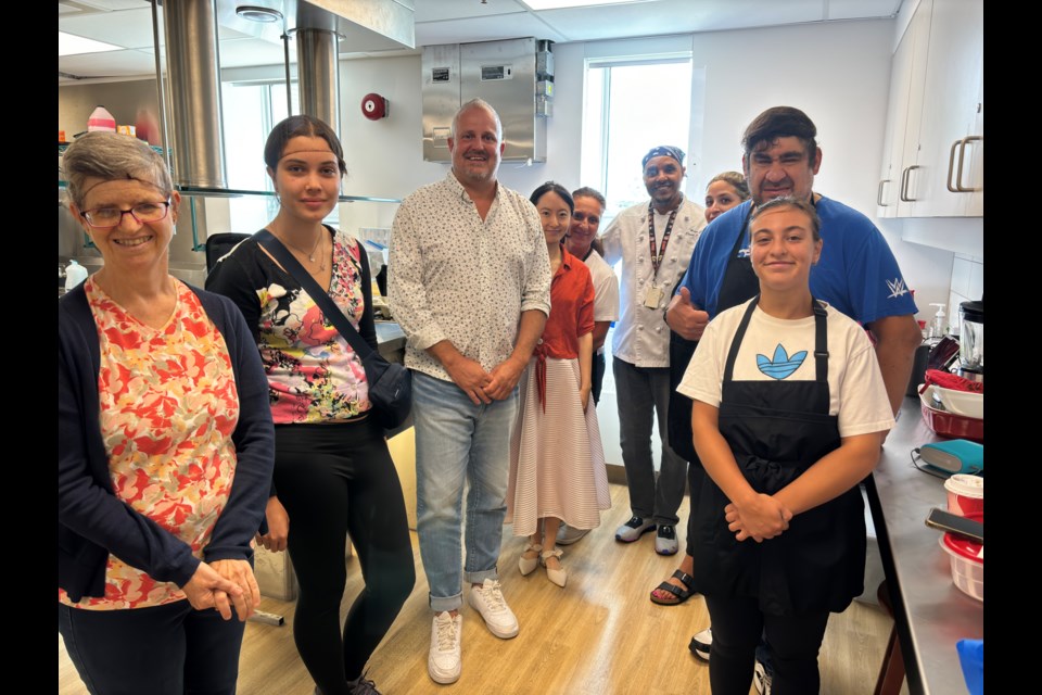 Andrew Fagan (third to left) is joined by clients of Community Living Central York in a cooking class.