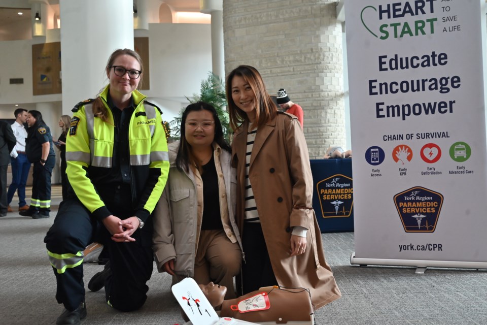 Primary care paramedic Natalia Krupin and CPR advocates Carmen Wong and Stephanie Ho at a York Region demonstration event Nov. 26.