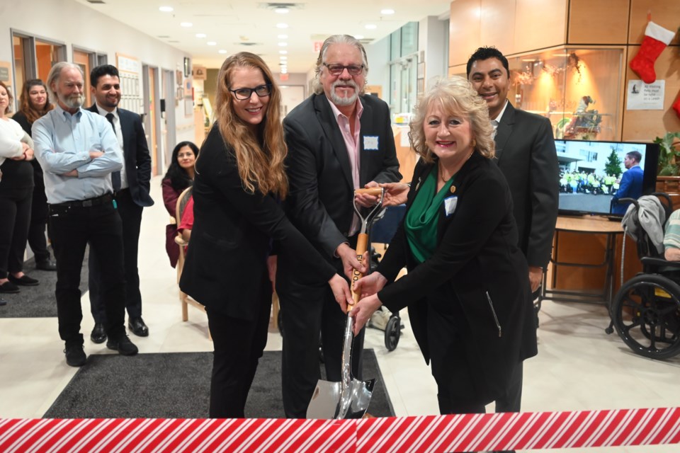 Southlake manager of clinical transformation Jennie Popplew, former Southlake CEO Dan Carriere, Newmarket-Aurora MPP Dawn Gallagher Murphy and Dr. Amit Upadhyay gather around a shovel to relive the groundbreaking of the Southlake Residential Care Village 20 years ago.  