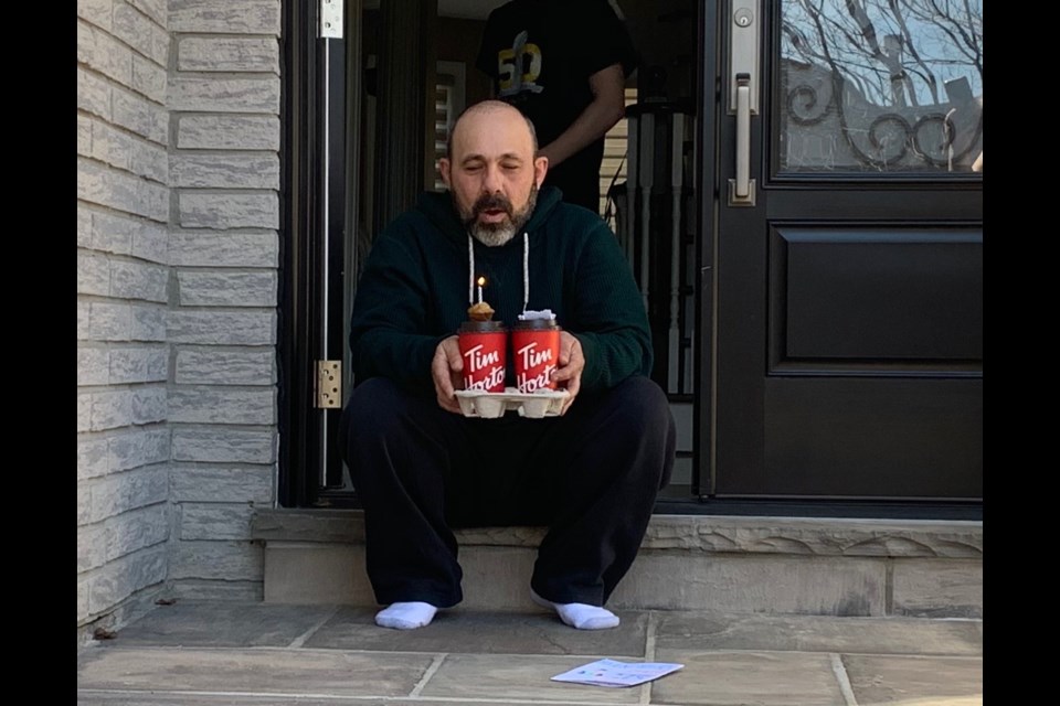 Nick Primaverile makes a birthday wish after a special doorstep  delivery today. Debora Kelly/NewmarketToday