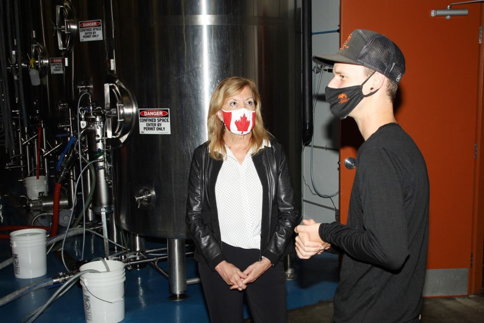 Market Brewing Company's Piers Simpkin tours the brewery with  Newmarket-Aurora MPP Christine Elliott around the brewery.  File photo/Greg King for NewmarketToday