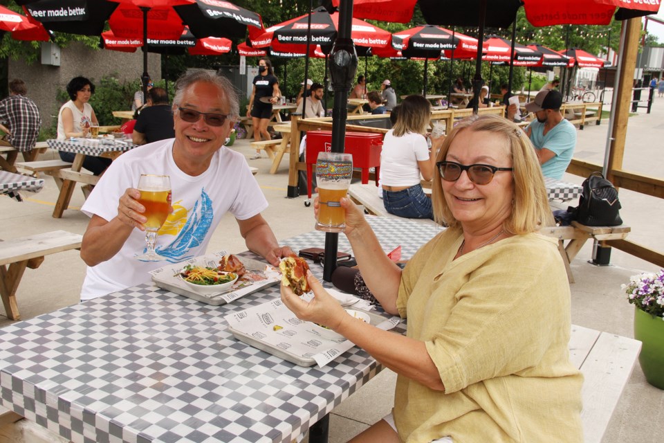 Sunny and Marika Lau are supporting local businesses by enjoying burgers at Ground Burger Bar.  Greg King for NewmarketToday