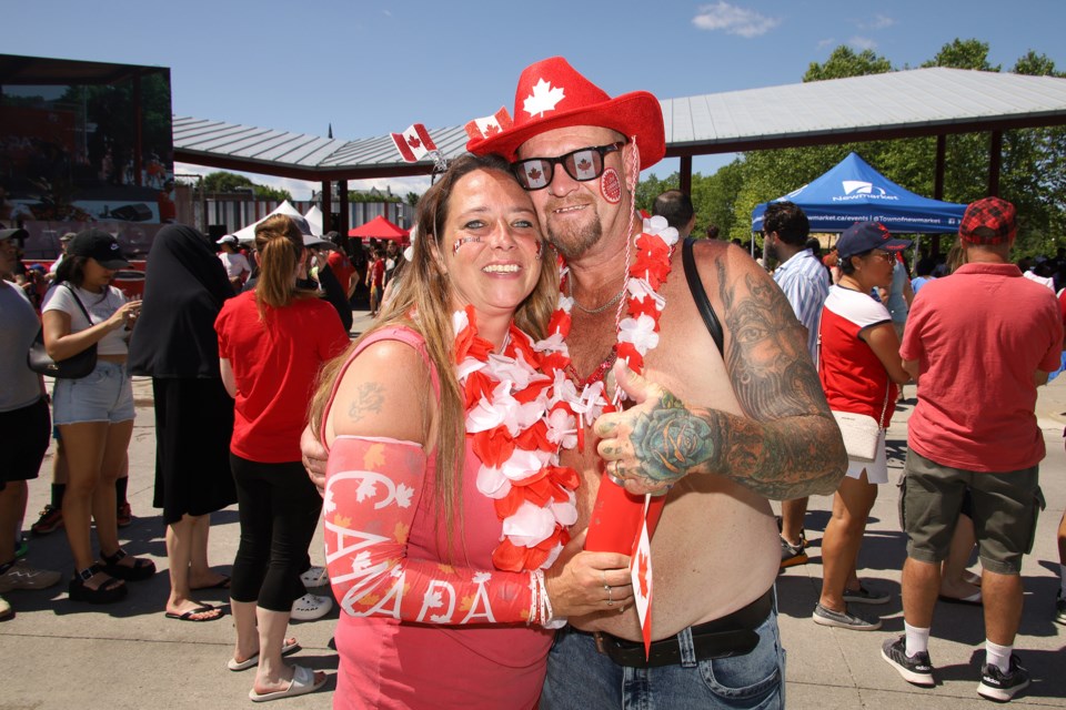 Andrea and Mark Burns are showing their patriotism at the Canada Day festivities at Riverwalk Commons in downtown Newmarket July 1.