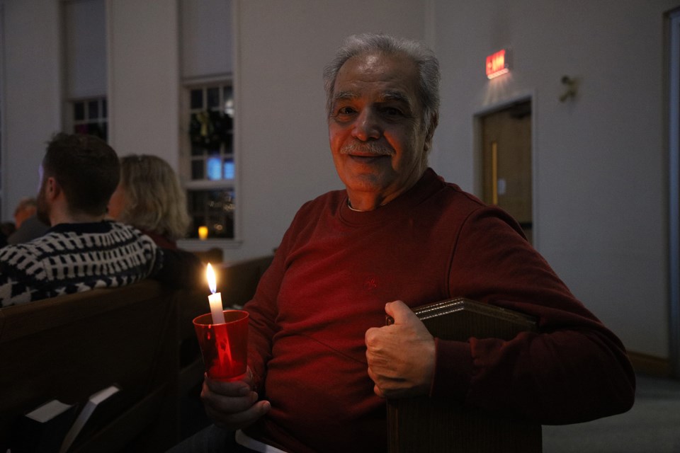 Gavar Shima attends the Christmas Eve candlelight service at St. Andrew's Presbyterian Church in downtown Newmarket.  Greg King for NewmarketToday