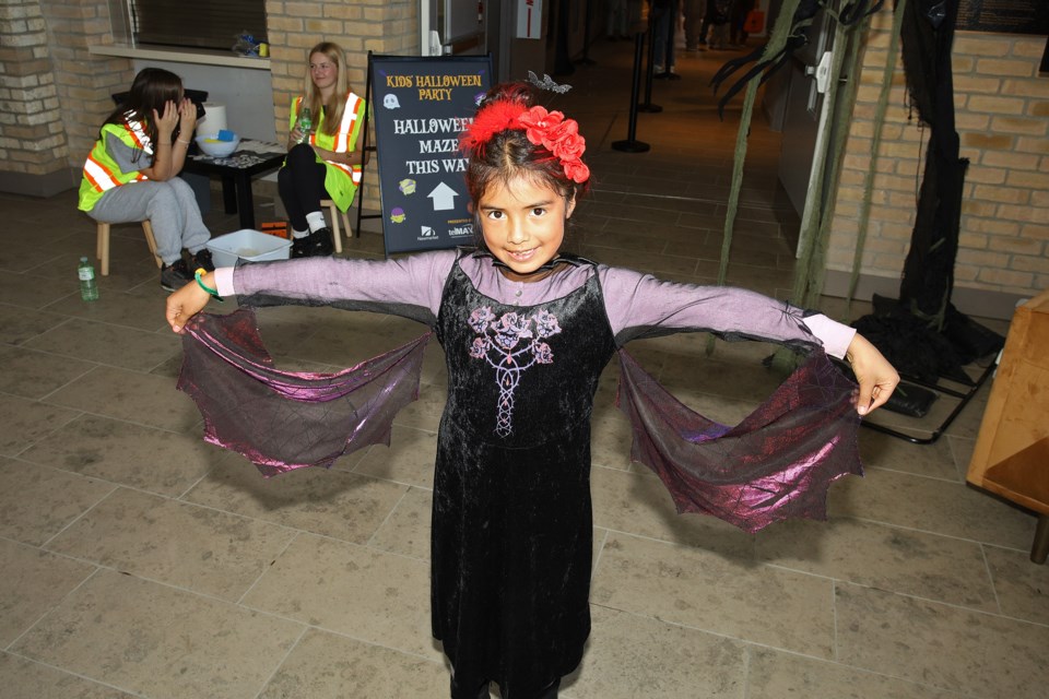 Abigail Suirez shows off her costume at the Town of Newmarket's new annual Kids' Halloween Party at Old Town Hall on Saturday.