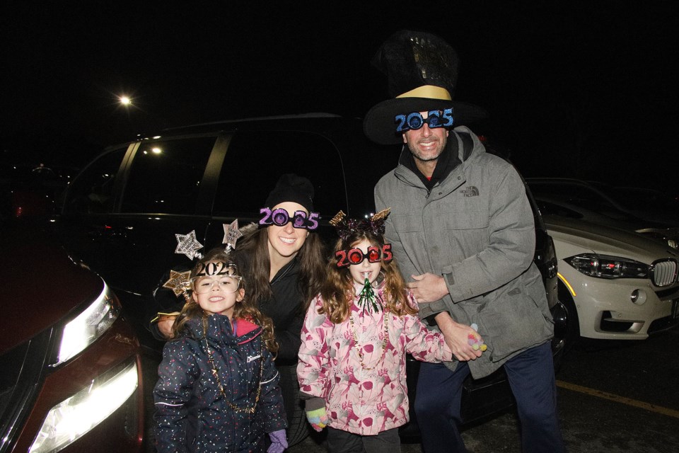 Arriving for the Tim Hortons First Night firework show to mark the arrival of 2025 are Edward and Jennifer Mourra with their daughters, Madilyn and Olivia, last night.