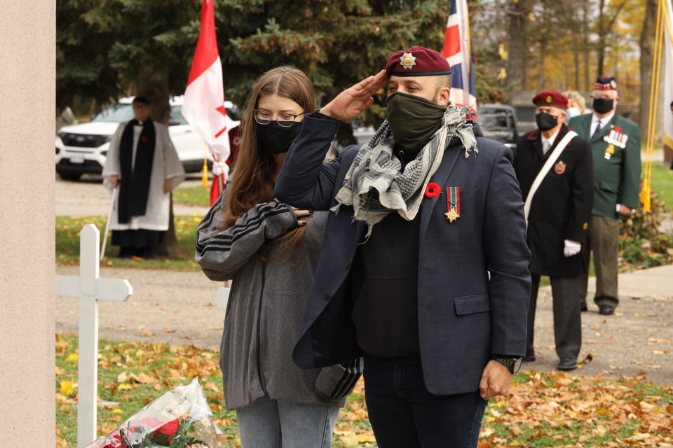 Afghanistan veteran Chris Dupee, with daughter Alycia, lays the wreath for the Government of Canada on behalf of Newmarket-Aurora MP Tony Van Bynen at today's Remembrance Day service hosted by the Newmarket Veterans' Association at the Newmarket Cemetery.  Greg King for Newmarket.