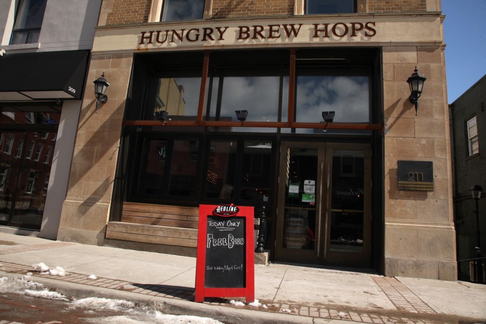 The sign says 'free beer' at Hungry Brew Hops on Main Street... Greg King for NewmarketToday.