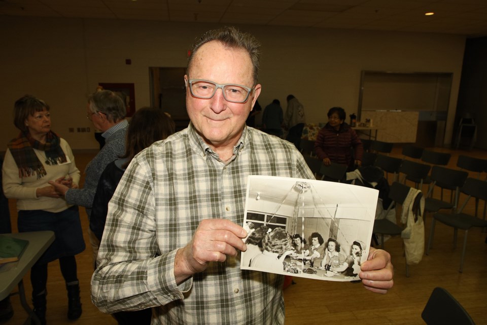 Danny Walsh holds a photograph of his mother from when she was working at De Havilland during the Second World War 2 at the Newmarket Historical Society's AGM and annual "bring and brag" event Jan. 15.