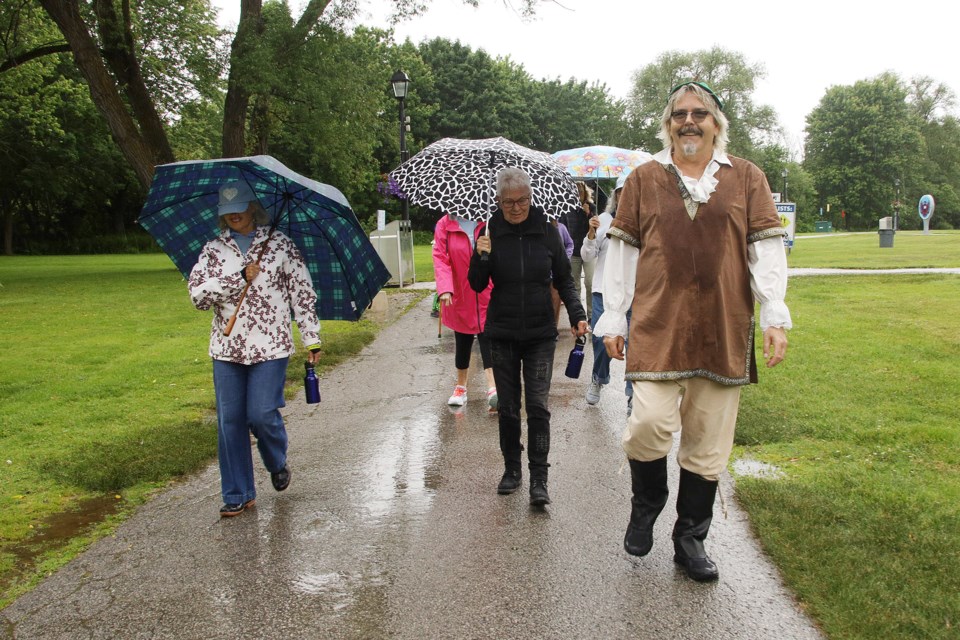 Christian Wehrli leads the Fairy Trail Walk for Esther in honour of his sister at Fairy Lake Park Sunday.