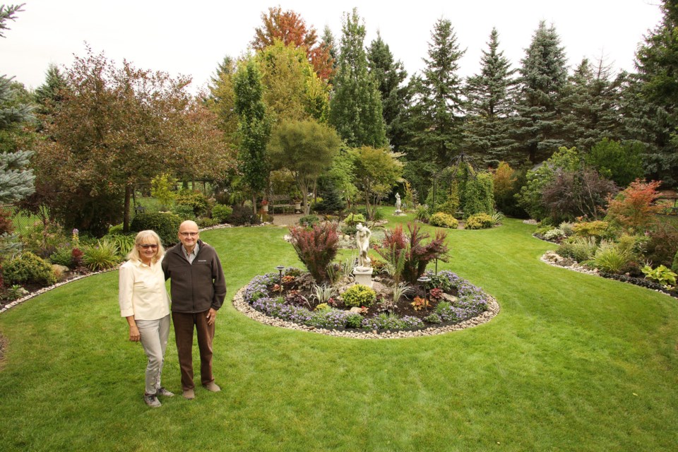 Aurora residents Sylvia Dobesberger and Ain Kirve in the Gardens of Madeline Heights.  Greg King for NewmarketToday