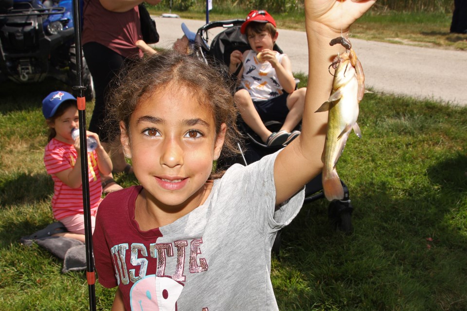 Gloria Mikhael caught a catfish today at the Newmarket Optimist Club's annual Fairy Lake Fish Out, in partnership with Aurora BassMasters, York Regional Police and York Regional Police Association.
 