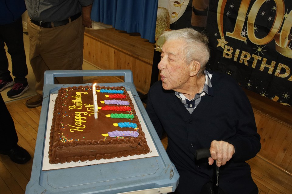 Second World War veteran Wilf O'Hearn blows out the candles on his cake at the surprise 100th birthday party hosted by the Royal Canadian Legion Branch 426 in Newmarket on New Year's Day.