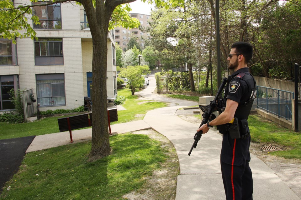 York Regional Police officers are stationed around the apartment building at Lorne and Davis, where a man with a knife is barricaded in a unit on Friday afternoon.
Greg King for NewmarketToday