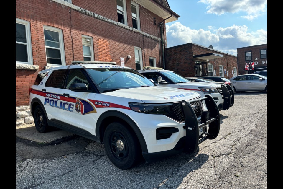 Police cruisers were parked at the building of the crime scene on July 16.