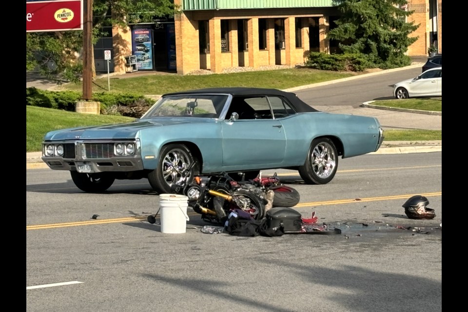 Shami Shah, the driver of the blue Buick, jumped out of his car to help the motorcyclist immediately after the accident occurred at about 6 p.m. July 18. 