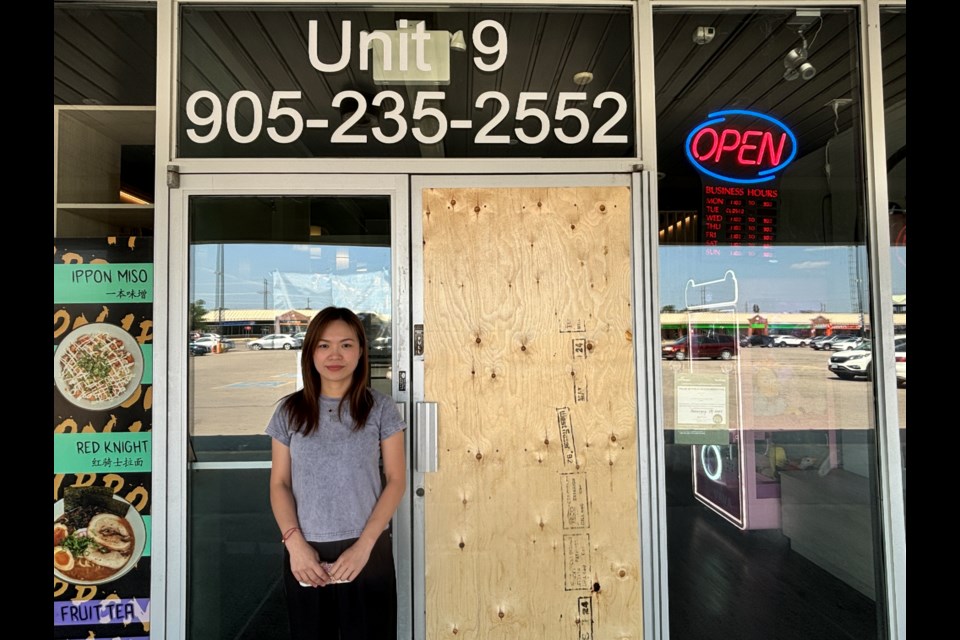 Jacqueline He, co-owner of Ippon Ramen, has to replace the door of the restaurant after a break in on July 28.