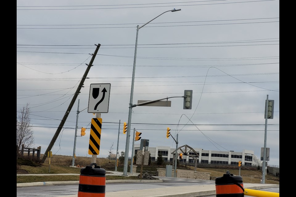 A hydro pole and down power lines in the intersection of Leslie Street and William Graham Drive in Aurora. 