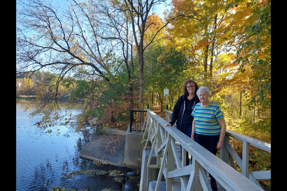 Anne Lagace Dowson and Barbara Blitzer stand at the Bogart pond as they rediscover their family history. 