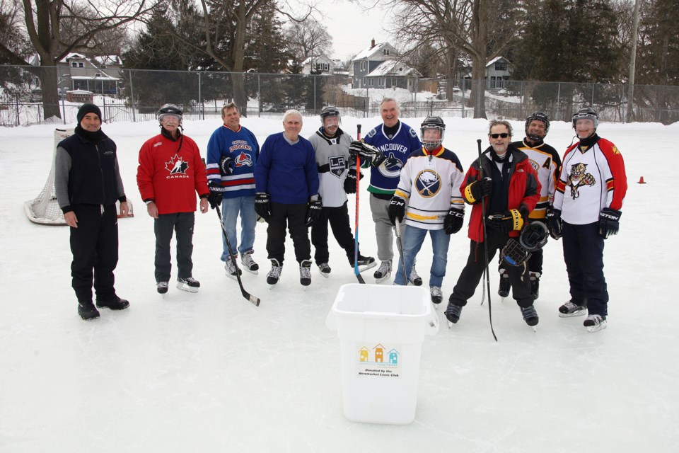 Lions Park Community Hockey Rink volunteer Chris Howie, along with Noel Edgar, Peter Wilson, Greg Ostryhon, Jim Stevens, Fred Stoneman, Peter Coates, Doug Mack, Steve Power, and Paul Tomlin gathered to play shinny last week. Each player donated $20 to the Newmarket Food Pantry, for a total of $180 to good cause.  Greg King for NewmarketToday