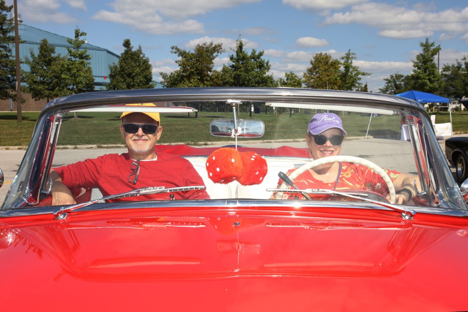 Benny and Kathleen Medeiros are all smiles in their 1955 Ford Sunliner at the Newmarket Car Club show at Ray Twinney Recreational Complex Saturday, Sept. 16.  Greg King for NewmarketToday