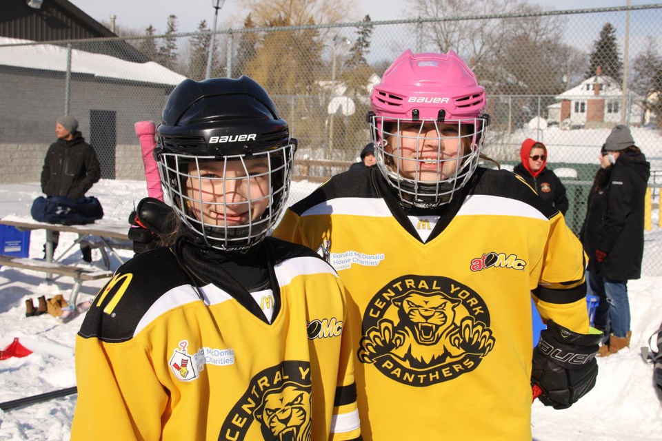 Sloan Briggs and Kathleen Passmore were among the Central York Girls Hockey Association players at Saturday's kickoff in Newmarket for the campaign to raise funds for  for automated external defibrillators.  Greg King for NewmarketToday