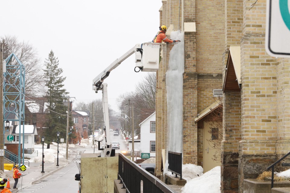 Photographer Greg King happened to catch the big effort needed to remove a massive icicle on Trinity United Church on Park Avenue yesterday. A Town of Newmarket cherry picker had to be used to start hacking away at the thick block of ice.