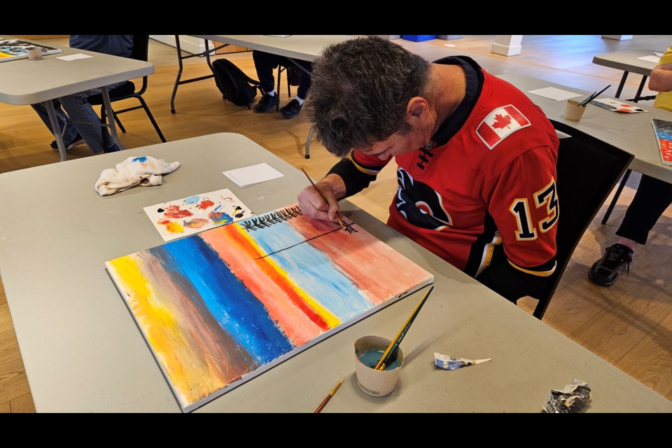 A participant with Community Living Central York working on his artwork during one of the art classes this January. 