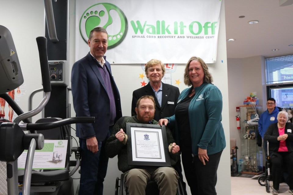 Newmarket Mayor John Taylor (from left), founder Kevin Mills, Deputy Mayor Tom Vegh and founder Heather Cairns-Mills at the ribbon-cutting ceremony for Walk It Off, now located at Yonge and Mulock.