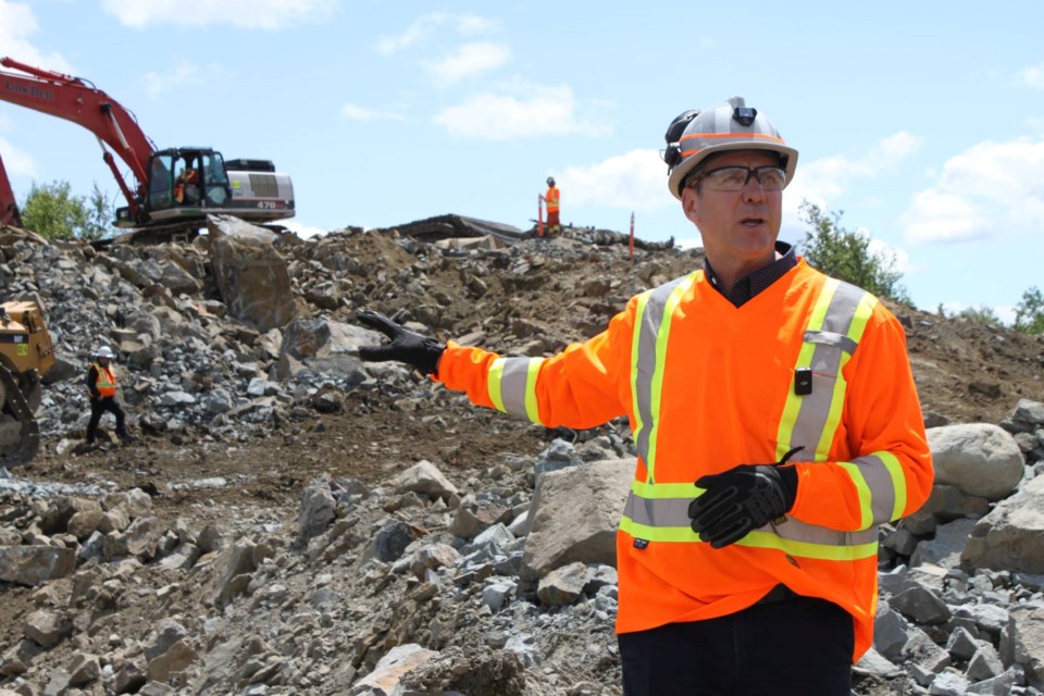 Jeff Huffman, chief operating officer at Magna Mining, guides a  tour of the company's Crean Hill project site on July 18, 2024.